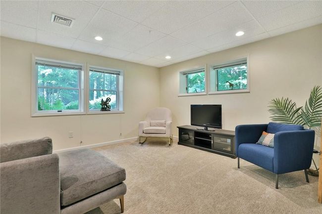 Lower level COd finished space with multiple rooms and so much storage. | Image 24