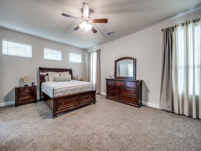 Luxurious primary bedroom is tucked away on the main level! | Image 19