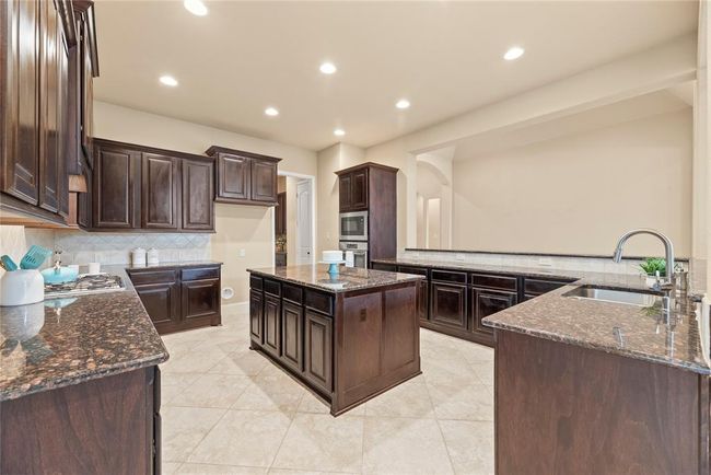 At the heart of the home is this amazing kitchen! Just look at all this counter space! | Image 15