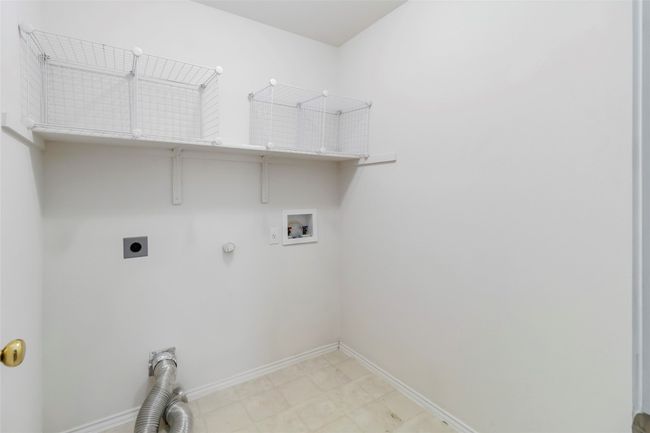 Laundry room featuring electric dryer hookup, hookup for a washing machine, hookup for a gas dryer, and baseboards | Image 32