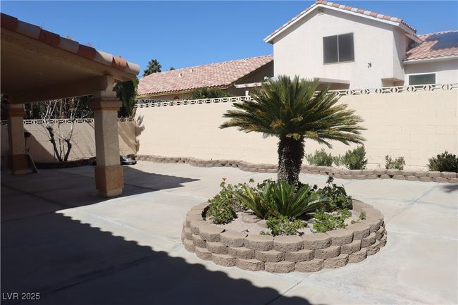 Fenced backyard with a patio | Image 68