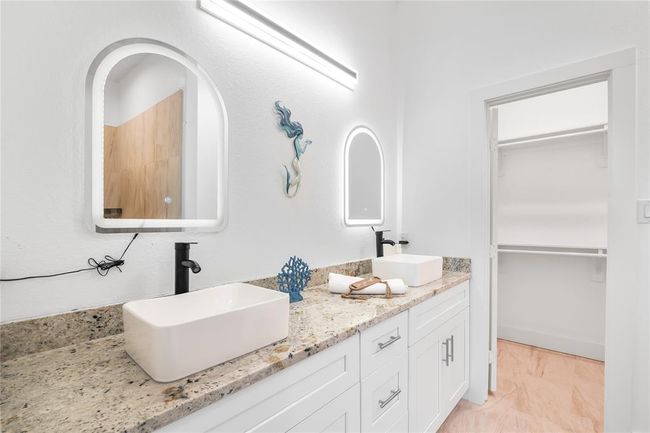 Elegant primary bathroom featuring dual sinks for added convenience. | Image 18