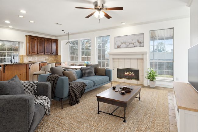 Virtually staged family room and view into kitchen - great open entertaining space | Image 11