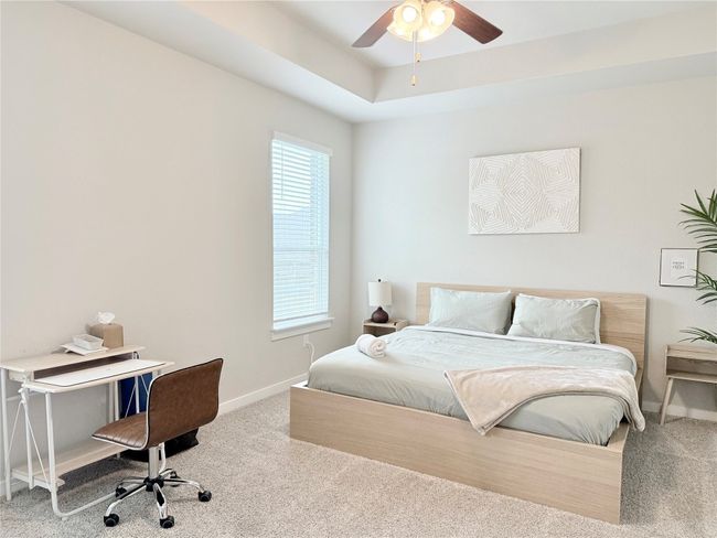 Bedroom featuring baseboards, a ceiling fan, and carpet floors | Image 17