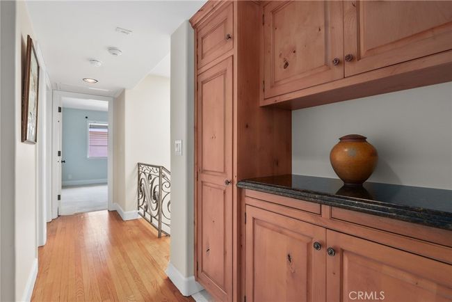 Come upstairs to find this GREAT linen closet area with pull out flat spaces convenient for ironing as laundry room is just across! | Image 21