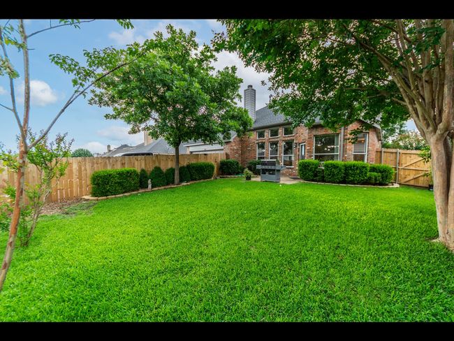 View of yard featuring a patio area and a fenced backyard | Image 5