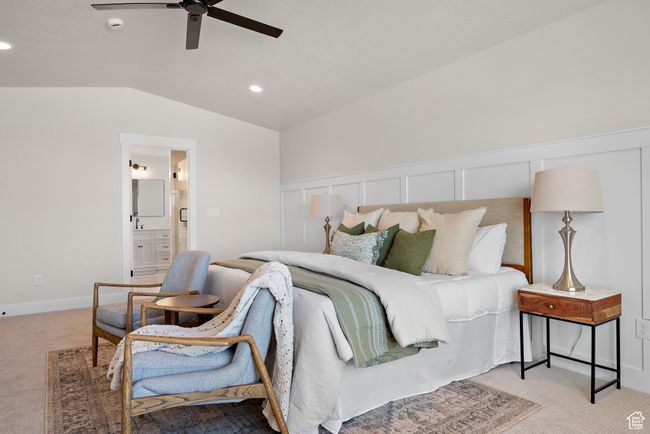 Primary Bedroom featuring light colored carpet, lofted ceiling, ensuite bathroom, recessed lighting, and ceiling fan | Image 20