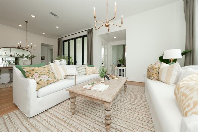Spacious and inviting living area perfect for hosting gatherings. | Image 15