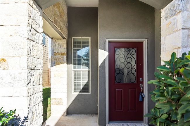 Entrance to property with stone siding and stucco siding | Image 5