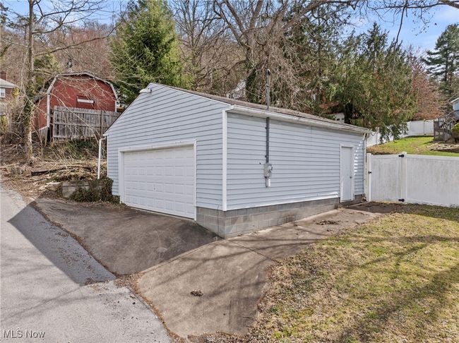 Detached garage featuring fence | Image 23