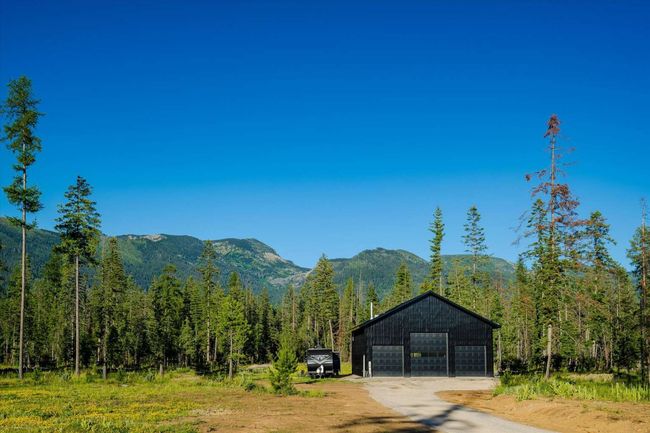 View of mountain backdrop featuring a heavily wooded area | Image 58
