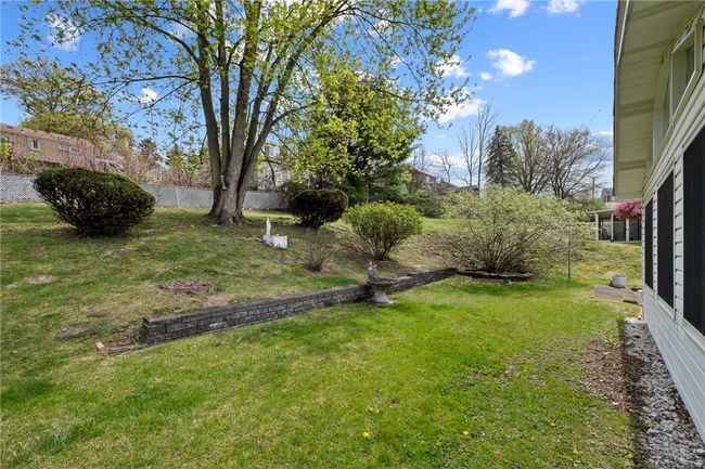 Lovely Landscaping Adorns The Backyard | Image 21