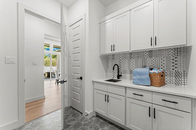 Fully functional Utility Room with a sink and plenty of storage | Image 16