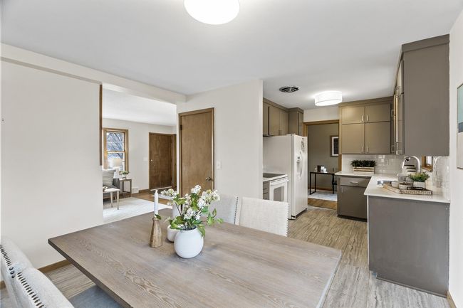 The open space between the dining and kitchen area is perfect for a relaxing meal or entertaining | Image 11