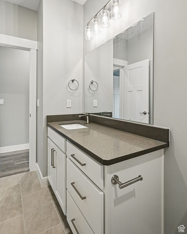 Bathroom featuring vanity and baseboards | Image 47