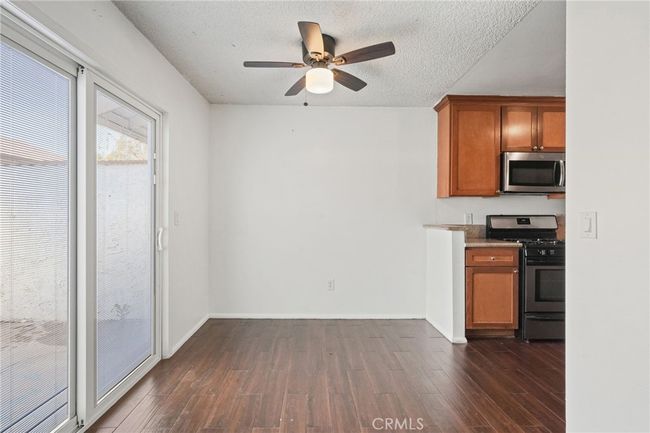 Dining area with sliding door to private patio | Image 4