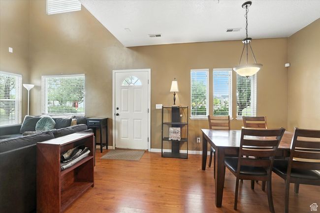 Dining room featuring wood finished floors and baseboards | Image 12