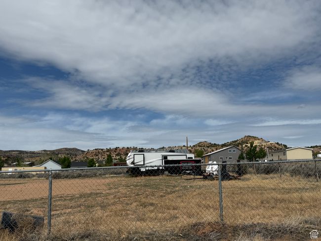 View of yard featuring fence and a mountain view | Image 22