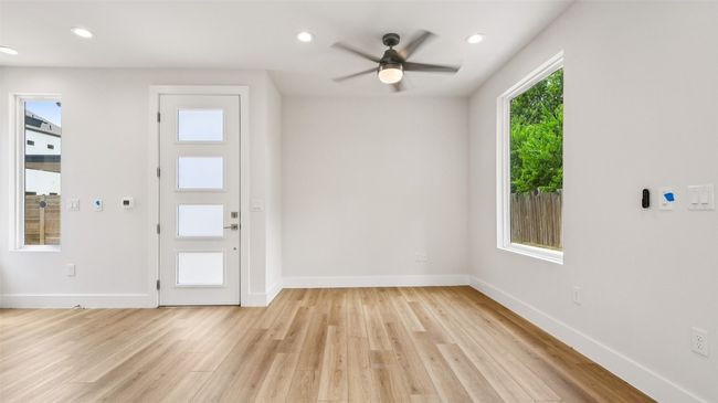 Entryway with light wood finished floors, recessed lighting, and ceiling fan | Image 5