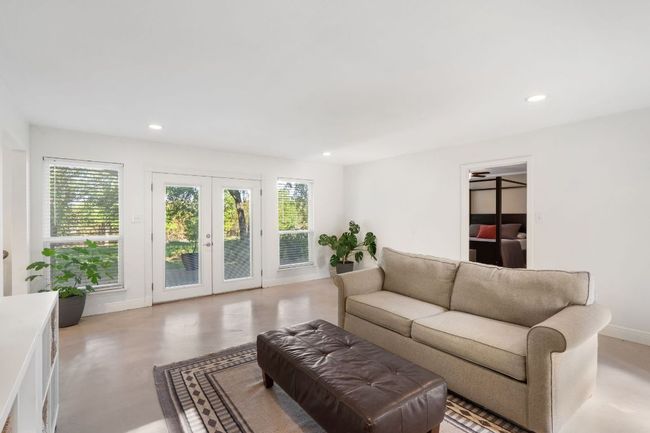 Living area opens to patio. | Image 14