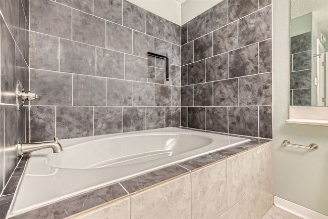 Full bathroom with tiled garden bathtub. | Image 12