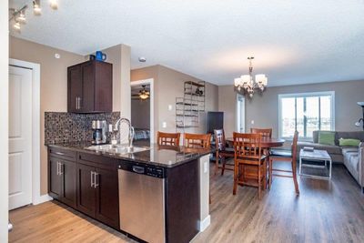 6407 - 403 Mackenzie Way Sw, Condo with 2 bedrooms, 2 bathrooms and 2 parking in Airdrie AB | Image 1