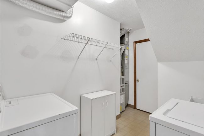 9x6 Main Floor Laundry with GE Washer 15 Cycle, 3 Wash/Spin, Heavy Duty Super Capacity Plus and Kenmore Dryer Included. Door Opens into 10'10" x 19 Garage. | Image 22