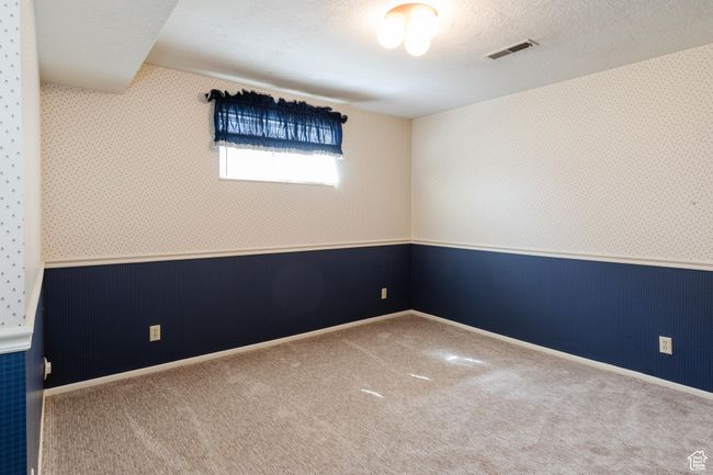 Unfurnished room featuring carpet floors and wallpapered walls | Image 26