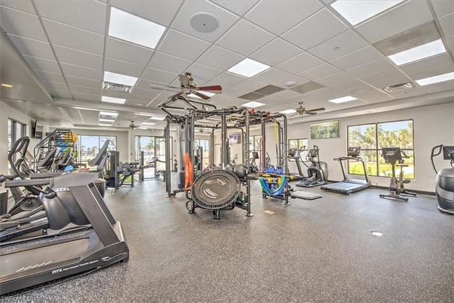 Gym with a ceiling fan and a drop ceiling | Image 36