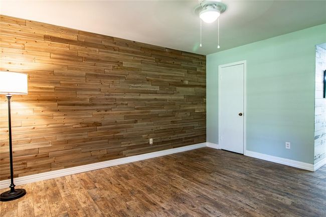 View of primary bedroom from window. Walk-in closet to the left of the photo. | Image 30