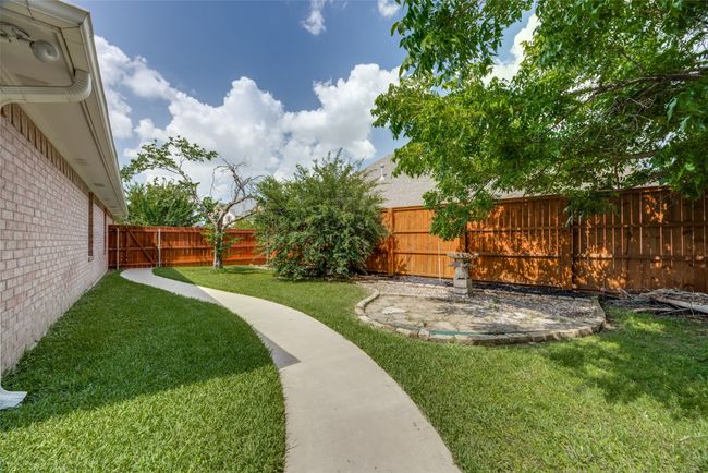 View of fenced backyard | Image 34