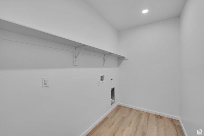 Washroom with hookup for a washing machine, light wood-type flooring, recessed lighting, hookup for an electric dryer, and gas dryer hookup | Image 30