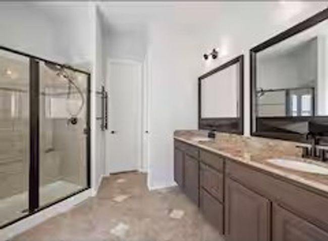 Bathroom with a shower stall and double vanity | Image 13