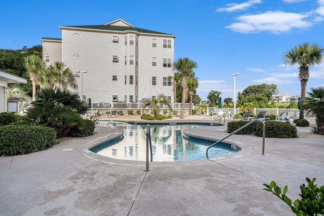 Community pool featuring a patio area | Image 24