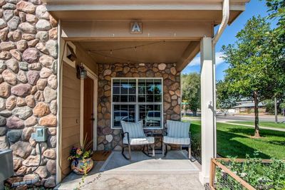 Cozy porch welcomes you into this bright and spacious end-unit townhome | Image 2