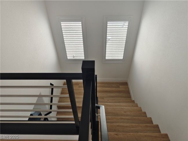 Staircase featuring wood finished floors and baseboards | Image 24