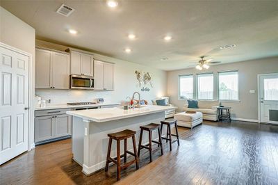 Kitchen with tall cabinets, long kitchen island | Image 2