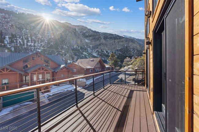 Balcony featuring a residential view and a mountain view | Image 14