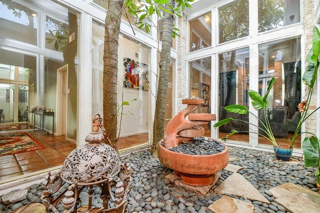 This exclusive, lush, indoor atrium is something you will not ordinarily encounter in your home search! 'Talk about living in nature, literally! | Image 6