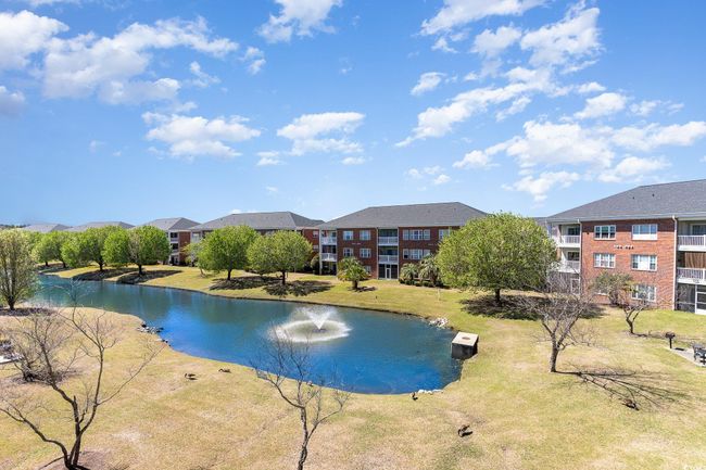 View of pool with a yard and a water view | Image 26