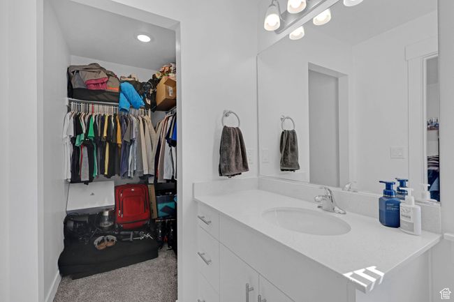 Bathroom featuring vanity and a walk in closet | Image 19