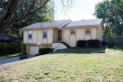 View of front of house featuring a front yard and a garage | Image 2