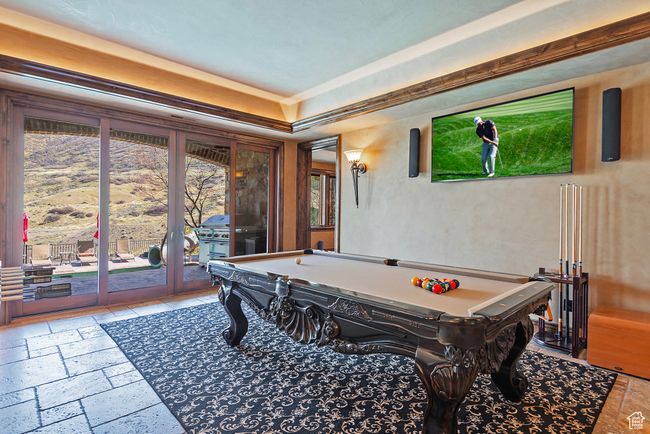 Game room featuring a raised ceiling, pool table, and stone tile flooring | Image 52