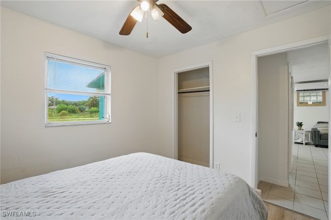 Bedroom featuring ceiling fan, a closet, and light tile patterned floors | Image 24