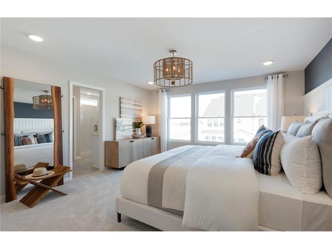 Huge windows and ample space make the Ashton Primary Bedroom one to remember! Photo of model home. | Image 32
