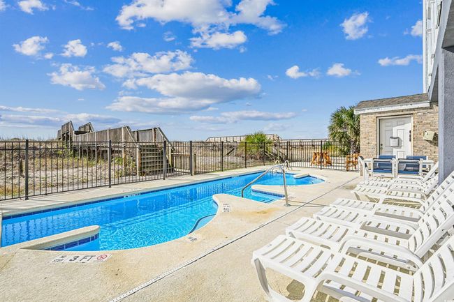 Community pool with a patio area and a jacuzzi | Image 36