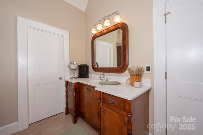 Separate Vanities feature custom cabinetry and furniture-style quality finishes | Image 25