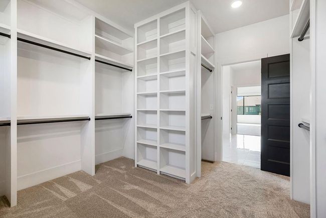 Spacious closet with carpet floors | Image 24