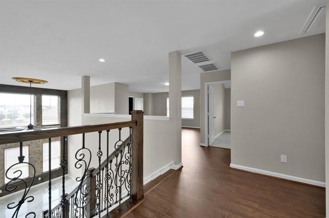 Upstairs Foyer with the staircase on the left, and Game Roomin the middle. | Image 22