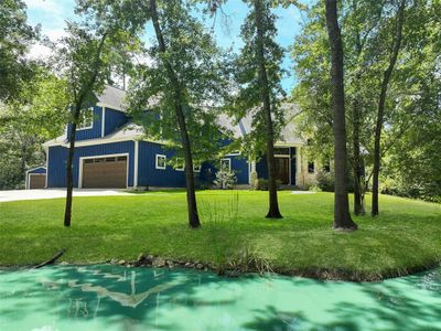 The retention pond adds beauty and serenity to this awesome wooded, elevated lot. | Image 3